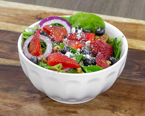 Berry Spinach Salad · Spinach, toasted walnuts, red onion, goat cheese, strawberries, blueberries, and citrus vinaigrette dressing.