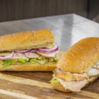 Hand-Carved Turkey Sub · Hand-carved turkey, with a touch of house-made garlic oil, with your choice of cheese and ad...
