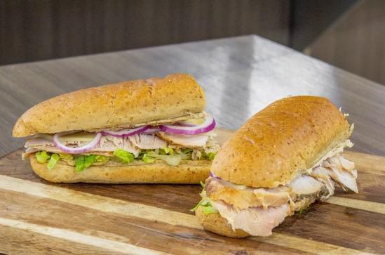 Hand-Carved Turkey Sub · Hand-carved turkey, with a touch of house-made garlic oil, with your choice of cheese and additional toppings.