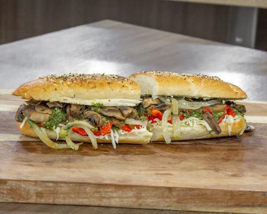 Veggie Sub · A touch of house-made garlic oil, roasted mushrooms, roasted red peppers, caramelized onions, and fresh mozzarella, topped with basil pesto with your choice of additional toppings.