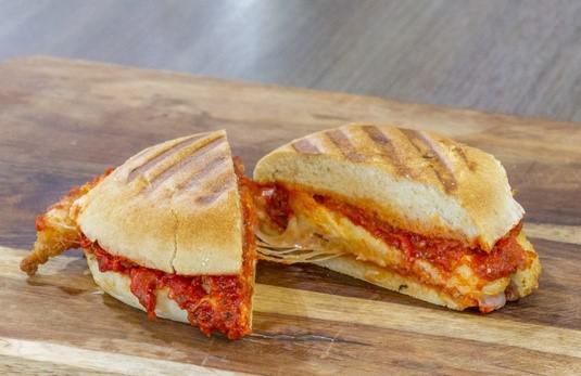Chicken Parm Melt · Humanely-raised breaded chicken, tossed in pizza sauce, topped with mozzarella and your choice of additional toppings, pressed on a griddle.