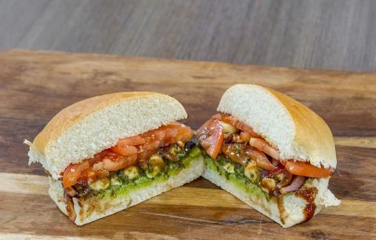Veggie Sandwich · Roasted mushrooms, roasted red peppers, caramelized onions, mozzarella, basil pesto, and your choice of cheese and additional toppings.