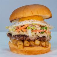 Slaw Burger · impossible patty, white American cheese, fries, haus slaw, fried egg, mayo.
