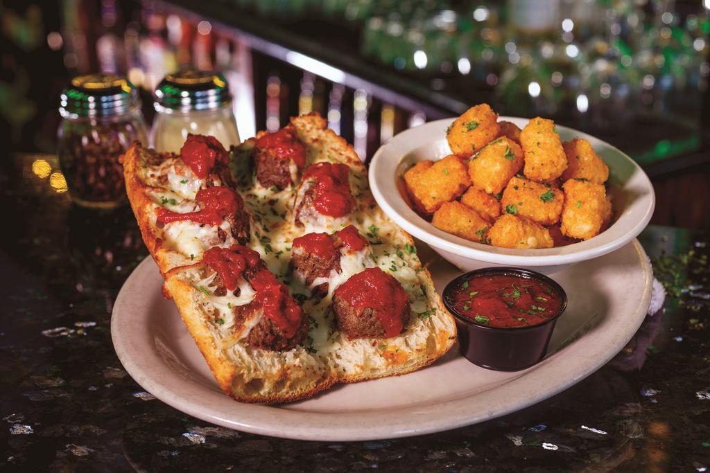 Meatball Hero · Juicy meatballs & zesty marinara sauce topped with melted mozzarella cheese on a Schmizza baguette