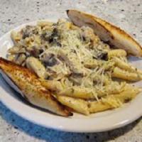 Steak Strip Alfredo · Tender mesquite beef strips and pan-fried mushrooms with penne pasta finished with our cream...