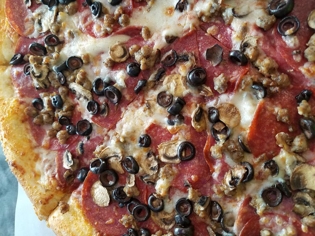 Genoa Combo Pizza · Genoa salami, mushrooms, olives, pepperoni and Italian sausage. 