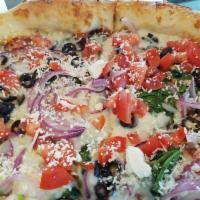 Greek Veggie Pizza · Fresh spinach, roma tomatoes, red onions, black olives, chopped garlic, and feta cheese.