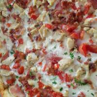 Chicken Bacon Ranch Pizza · Garlic chicken, bacon crumbles, Canadian bacon, and cooked tomatoes, atop a ranch base with ...