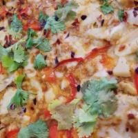 Spicy Thai Pizza · Garlic chicken, roasted red peppers, crushed red peppers & cilantro on top of a spicy peanut...