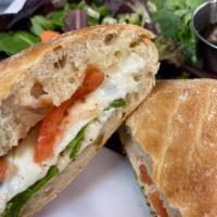 Caprese Sandwich · Served on ciabatta with fresh mozzarella and topped with seasoned tomatoes, olive oil, Itali...