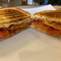 Bacon Tomato Melt · Bacon, marinated tomato with cheddar cheese served on white or wheat