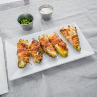 Jalapenos · Wrapped in bacon and stuffed with cream cheese and prosciutto.