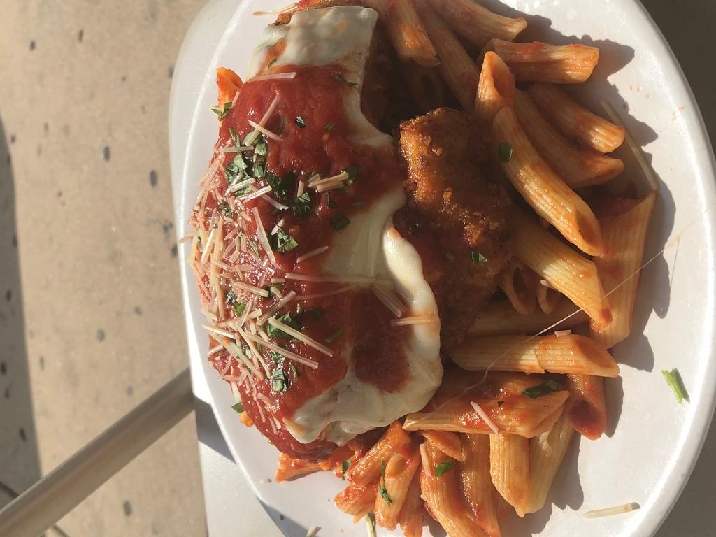 Chicken Parmesan · Panko crusted chicken cutlet topped with mozzarella cheese homemade garvy served over penne.