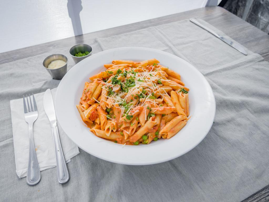 Penne Alla Vodka · Penne topped with vodka cream sauce, sweet peas and prosciutto. Add shrimp and chicken for an additional charge.