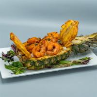 21. Pineapple Bowl Rice Stew · Consist of beef or shrimp caribbean stew, served in a fresh pineapple bowl with arroz con ga...