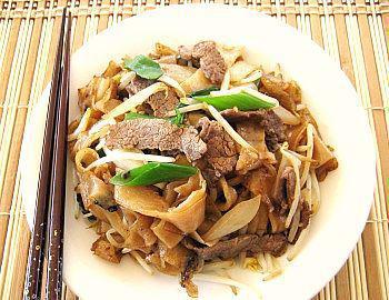 54. Stir fried Flat Rice Noodles With Beef OR Chicken · Stir fried flat noodle. With beef or chicken.
