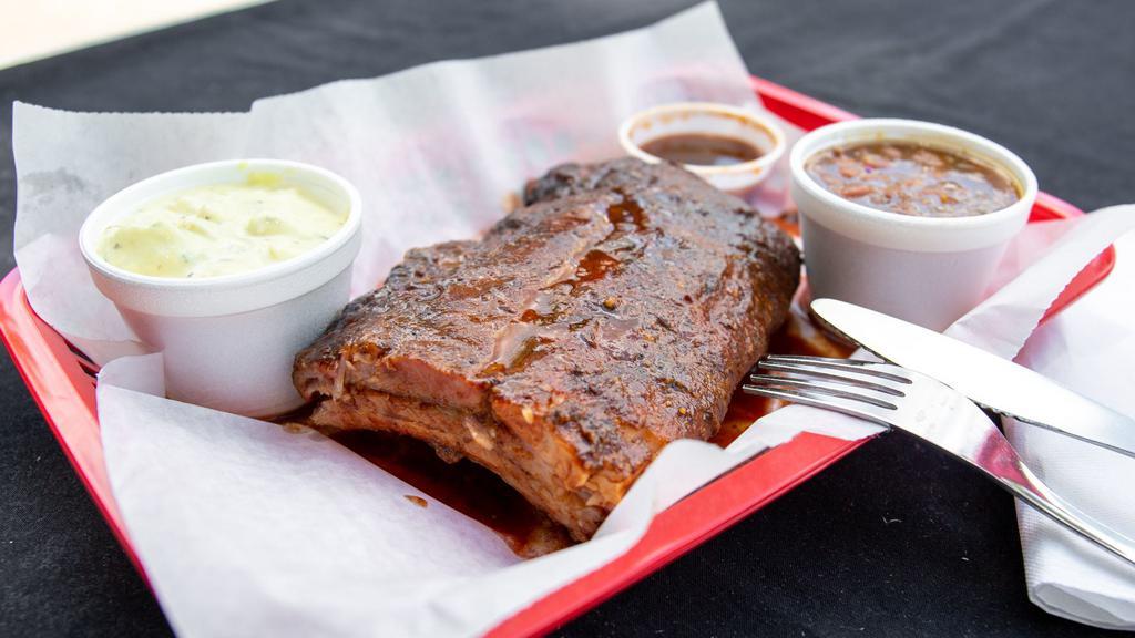Baby Back Ribs with 2 Sides · A cut of meat taken from the top of the rib cage.