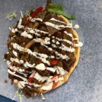Lamb gyro one pita bread · Lamb with lettuce tomato white sauce and hot sauce 