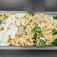 Chicken Fettuccine Alfredo · Fettuccine in a creamy Alfredo sauce with chicken and spinach. Served with our homemade garl...