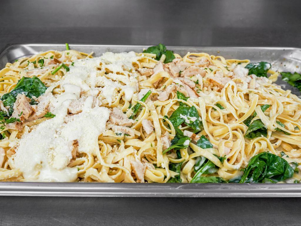 Chicken Fettuccine Alfredo · Fettuccine in a creamy Alfredo sauce with chicken and spinach. Served with our homemade garlic bread.