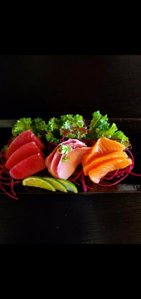 Sashimi Sampler  · 9 pieces of tuna, salmon, yellowtail. 3 pieces each. 