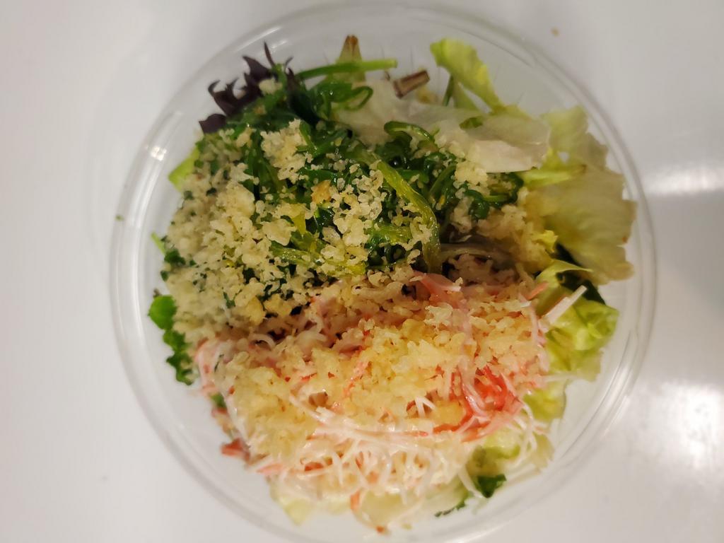 Kani and Seaweed Salad  · Spicy imitation crab salad and seaweed salad with house dressing on fresh greens. 