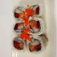 Triple Roll · Tuna, salmon, white tuna roll with spicy mayo and masago on top.