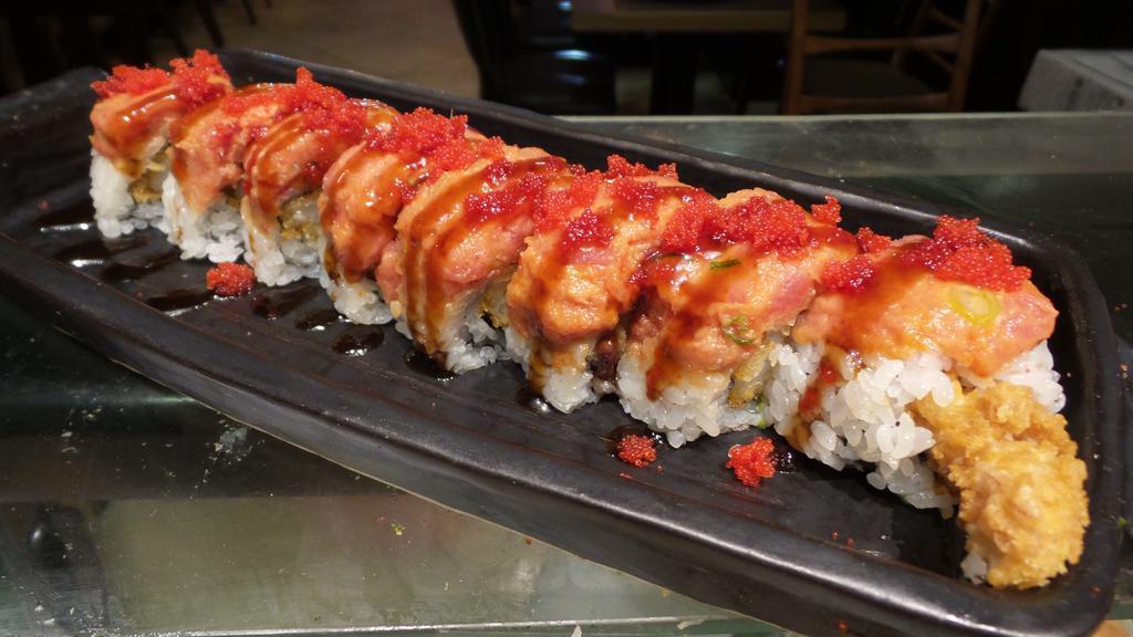 Angry Dragon Roll · Jumbo roll. In: shrimp tempura eel avocado, cucumber Top: spicy tuna, spicy sauce, eel sauce.