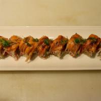 Monster Roll · In: tuna, salmon, avocado. Top: seared crab, sp mayo, eel sauce, scallion