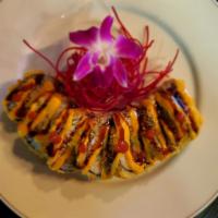 Ninja Roll · IN:   Spicy tuna, scallion, shrimp tempura    TOP:   spicy mayo, eel sauce, deep-fried