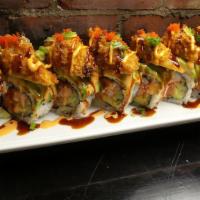Oyster Dream Roll · In: spicy tuna, crab, cucumber. Top:  avocado, fried oyster, sp mayo, eel sauce, masago, sca...