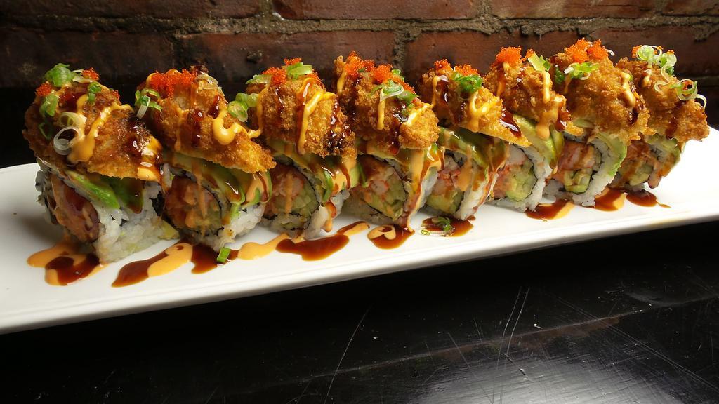 Oyster Dream Roll · In: spicy tuna, crab, cucumber. Top:  avocado, fried oyster, sp mayo, eel sauce, masago, scallion.