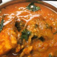 Chicken Curry · Served with rice.Chicken cooked with ginger, garlic, onion and tomato. 