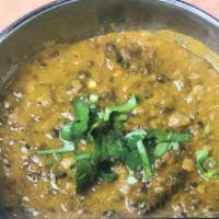 Dhal Tarka · Served with rice .Lentils, ginger, garlic and onion cooked in traditional Indian spices 