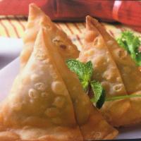 Samosa · Crispy pastry filled with potatoes, peas and spices come with tamarind and mint sauce 
