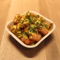 East Village Tots · Cheese whiz and pickled jalapenos.