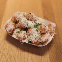 Truffle Shuffle Tots · Truffle oil, Parmesan cheese and herbs.