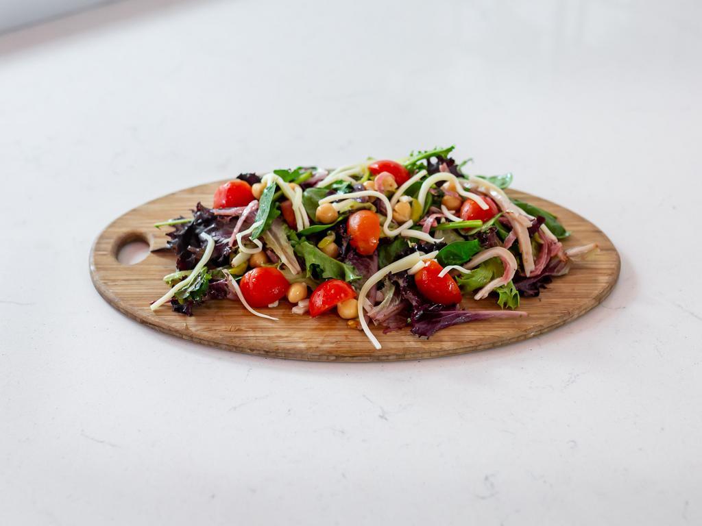 Italian Chopped Salad  · Mixed greens, salami, turkey, tomatoes, garbanzo beans, pepperoncini, Swiss cheese and balsamic dressing.