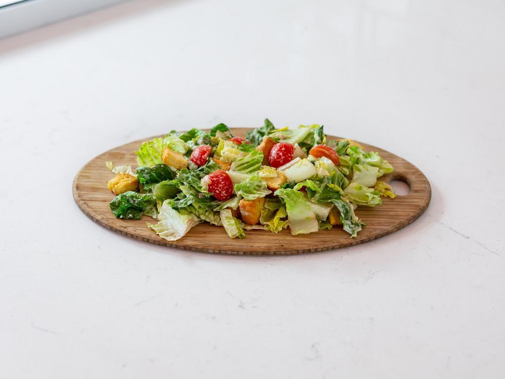 Chicken Caesar Salad  · House smoked chicken, romaine lettuce, tomatoes, Parmesan, croutons and Caesar dressing.