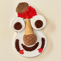Cookie Puss® Cake · A favorite party guest with layers of vanilla and chocolate ice cream, separated by a layer ...