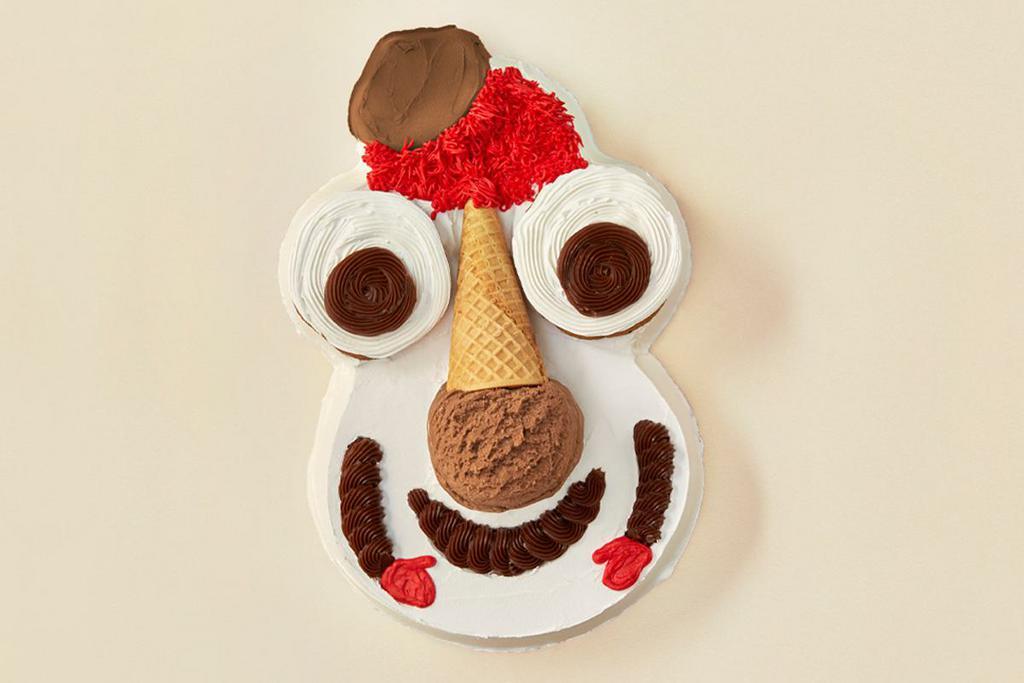 Cookie Puss® Cake · A favorite party guest with layers of vanilla and chocolate ice cream, separated by a layer of chocolate crunchies then topped with a scoop of chocolate ice cream in a sugar cone, two chocolate chip cookies and fudge. Serves 10-12 people.