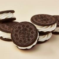 OREO® Rounders (6-Pack) · Vanilla ice cream sandwiched between two mini OREO® cookies.