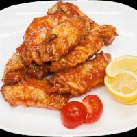 Chicken Wings (7 pieces.) · Jumbo wings, spices, and BBQ sauce.