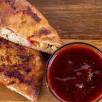 BBQ Chicken Calzone · Mozzarella, roasted chicken, & caramelized onions, house BBQ sauce to dip