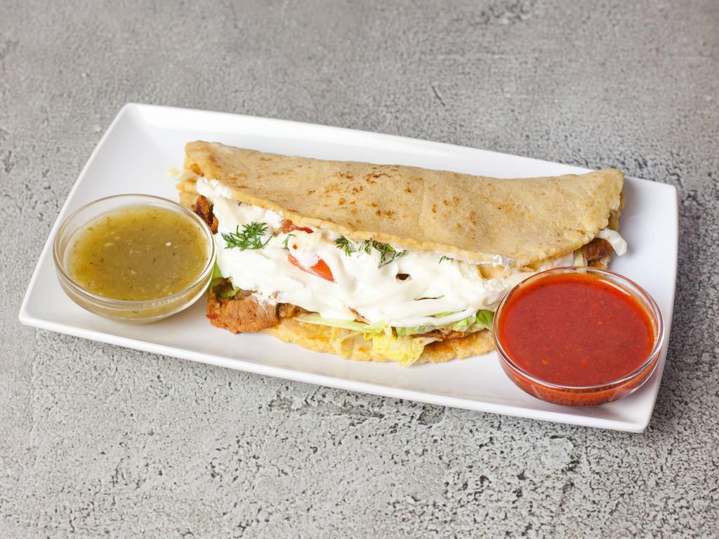 41. al Pastor Quesadilla · Roast pork. Homemade tortilla filled with choice of meat and melted cheese, onion, lettuce, tomato, cilantro and cream.