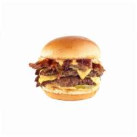 Smoked Brisket Burger · Hand-smashed double patty topped with American cheese, smoked brisket, Honey BBQ Sauce, baco...