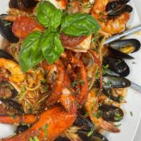 Frutti di Mare  · Lobster, shrimp, calamari, mussels and clams, served over linguini.