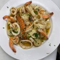 Seafood Risotto  · Served with lobster, calamari, shrimp, and scallops.