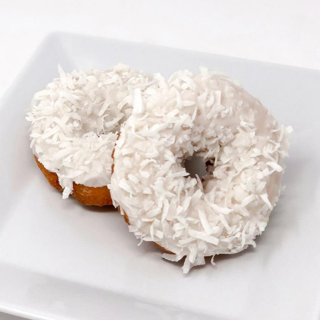Coconut Cake Donut · Our plain cake donut with a white glaze and coconut on top. You might need a pineapple danish to go with this one!