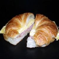 Ham & Cheese Croissant · A flaky butter croissant filled with ham, egg & Swiss cheese is a perfect balance of rich an...